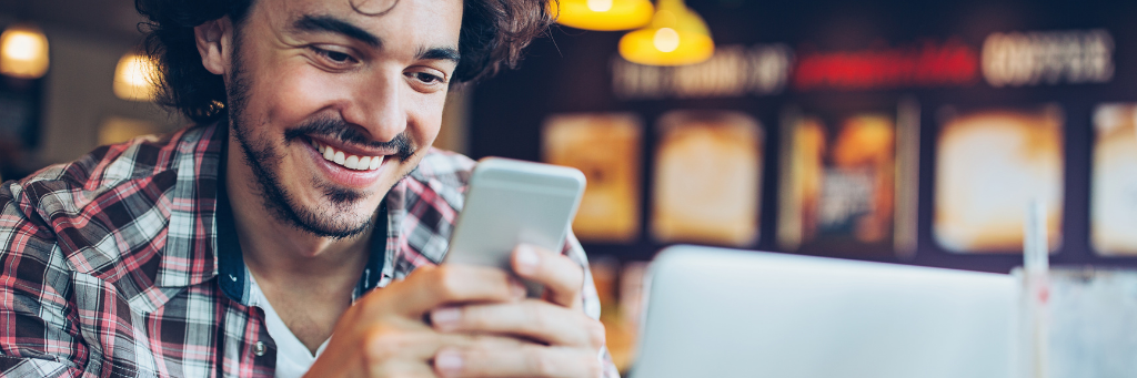 Picture of a man using his mobile phone