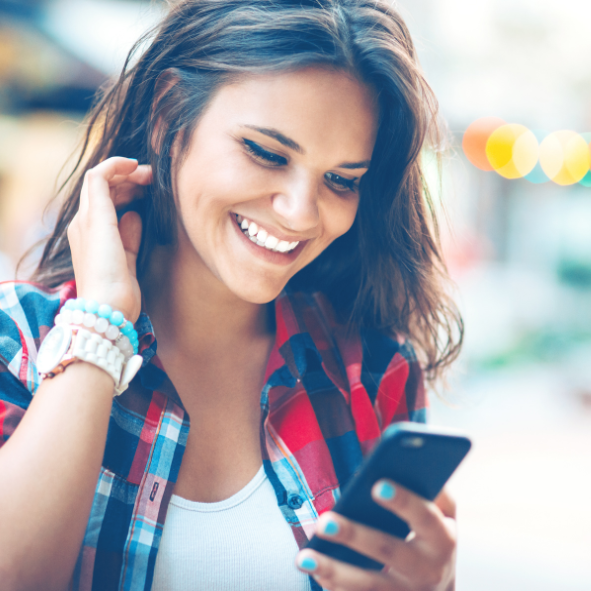 Picture of a lady texting on her mobile phone