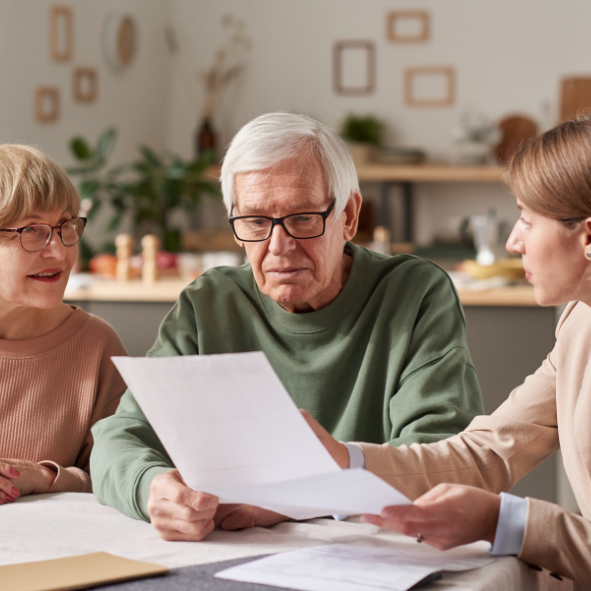 Picture of a man with his family reviewing the content of his Will