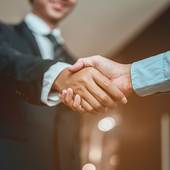 Two men shaking hands.