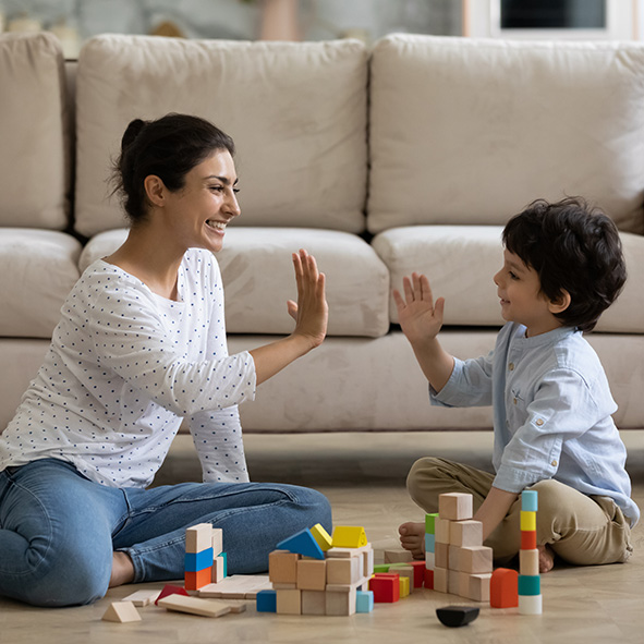 Mother and son high-fiving.