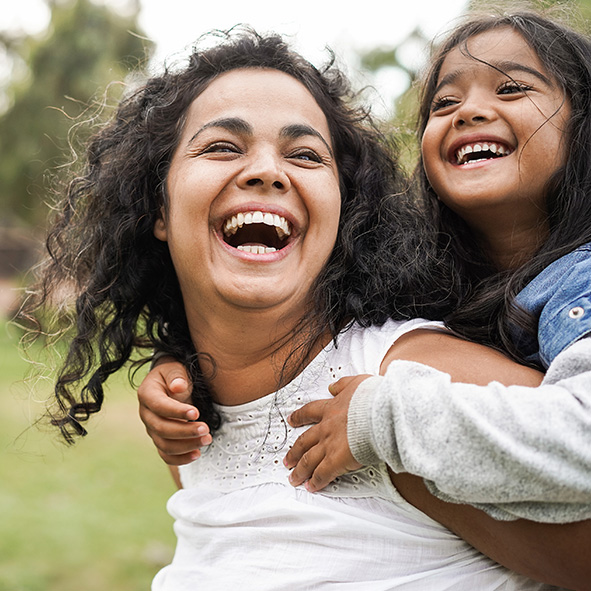 Mother and daughter laughing.