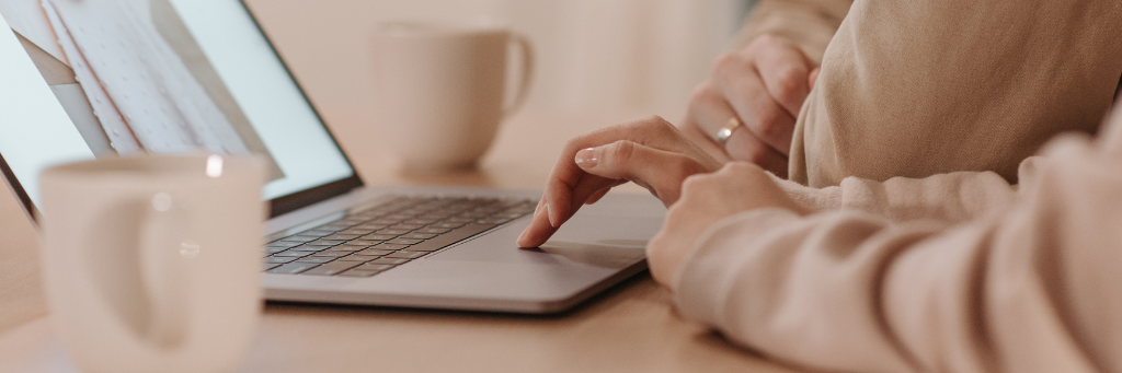 Picture of a person working at home on a laptop.