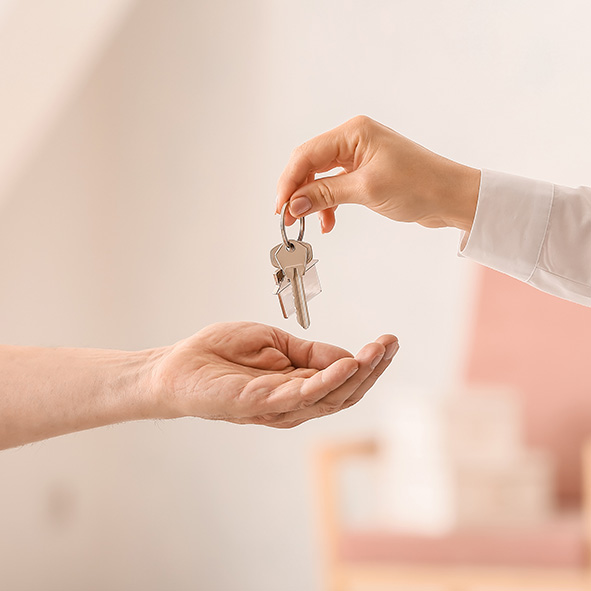 House keys being given over to homeowner.