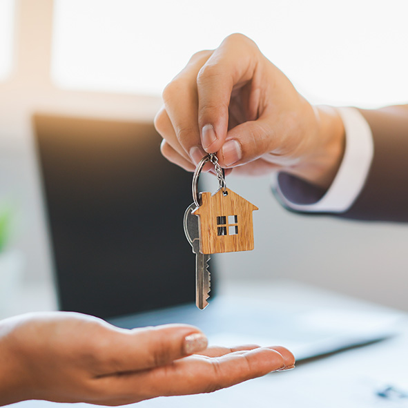 person being handed keys to their property