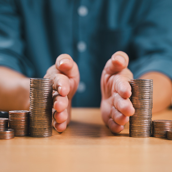 Person dividing stack of coins