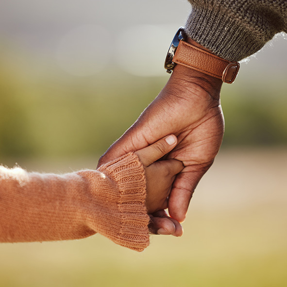 Father and daughter holding hands.