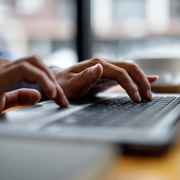 Person typing on a laptop