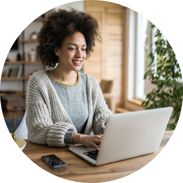 Picture showing a lady reading a Blog on her laptop