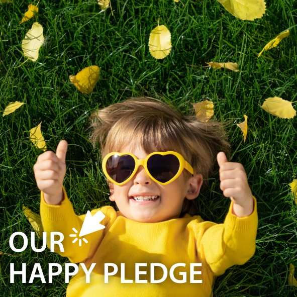 Picture of a child wearing yellow and sunglasses with thumbs up