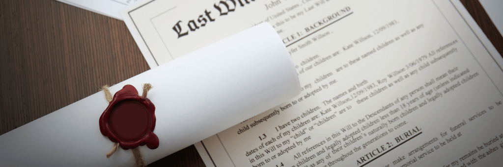 Picture showing a sealed scroll resting atop a Last Will and Testament