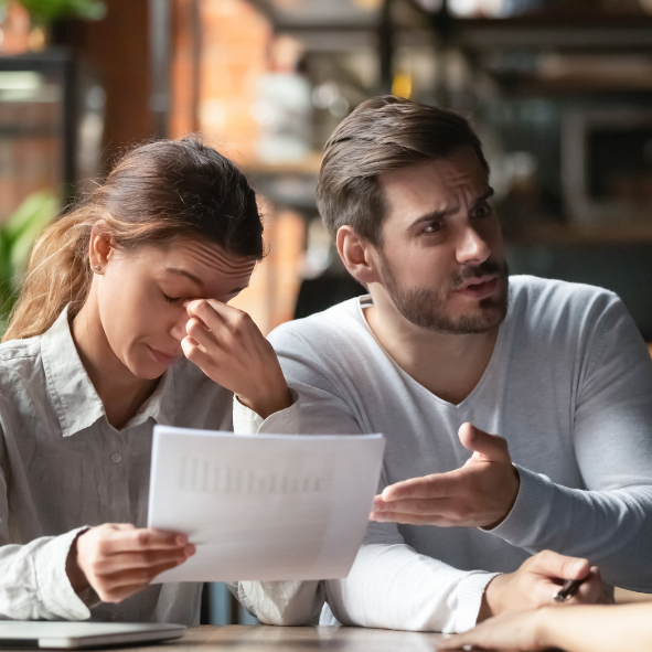 Picture showing a man and women visibly frustrated at having received bad advice