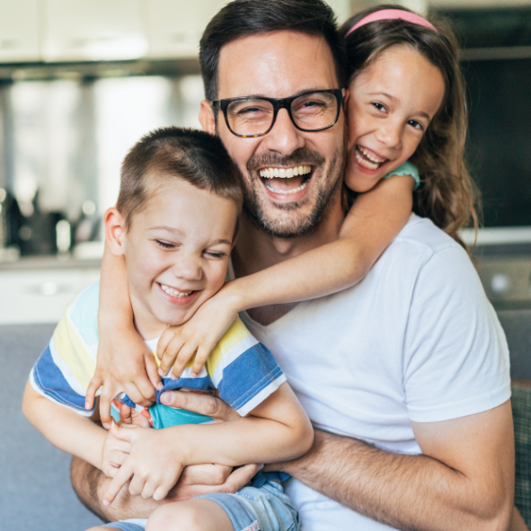 Picture of a happy father and happy children together.